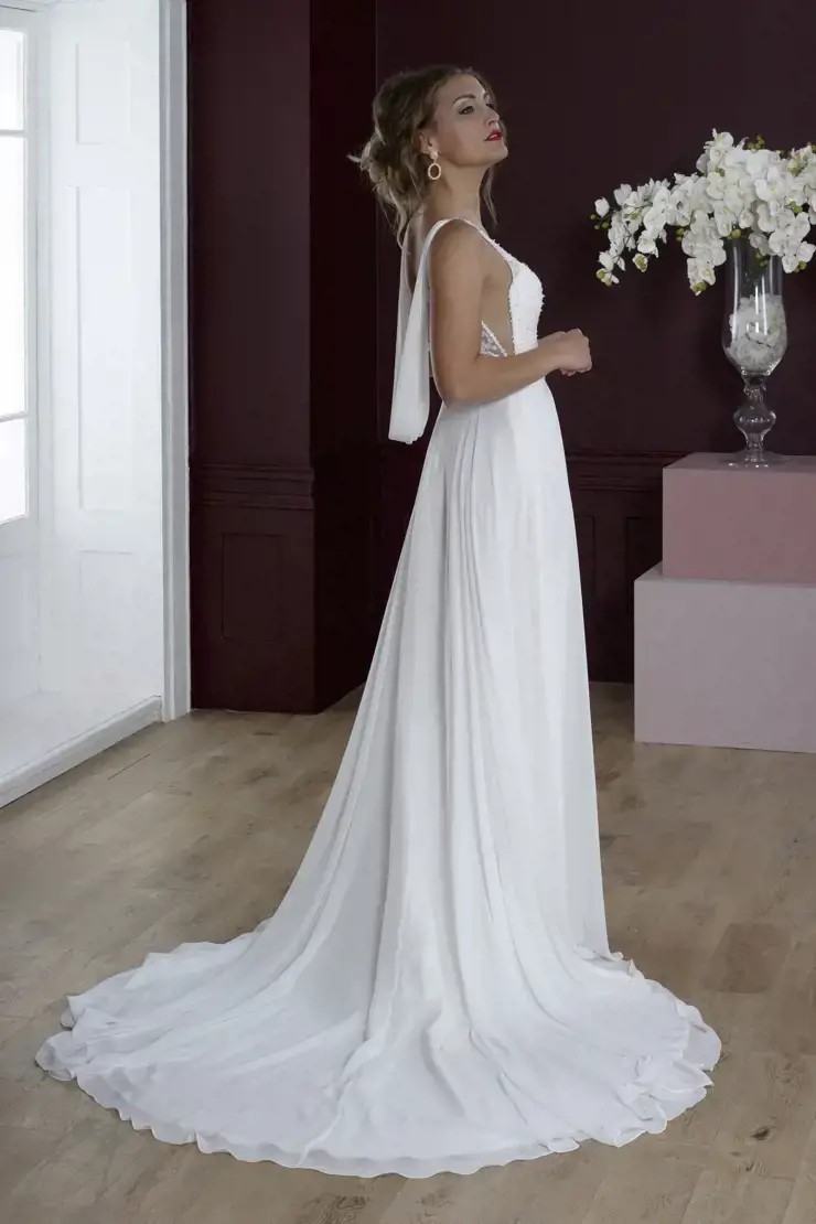 Model wearing a gown by House of Nicholas